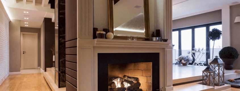 Floor-to-ceiling fireplace walls combine industrial materials, clean lines, and modern interior architecture to create timeless living spaces.